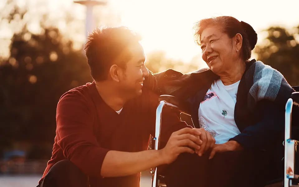 Mother and son smiling at eachother