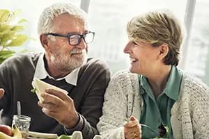 older couple smiling at eachother