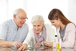 seniors doing puzzle together