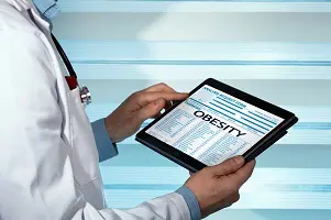 bariatric physician with a Obesity diagnosis of patient in digital medical report / Endocrine consulting medical record on tablet with text Obesity in the diagnostic