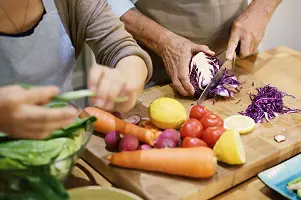 senior couple cooking together