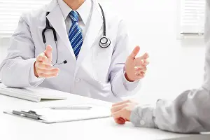 Physician talking with his hands