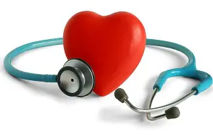 Stethoscope and heart on white background