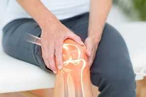 Someone holding their knee