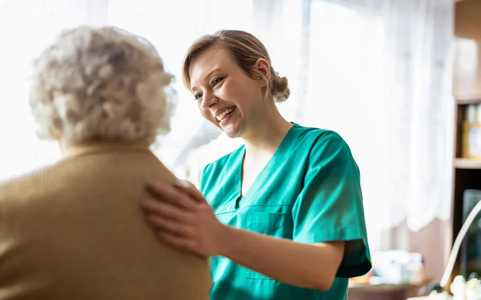 Worker smiling with patient