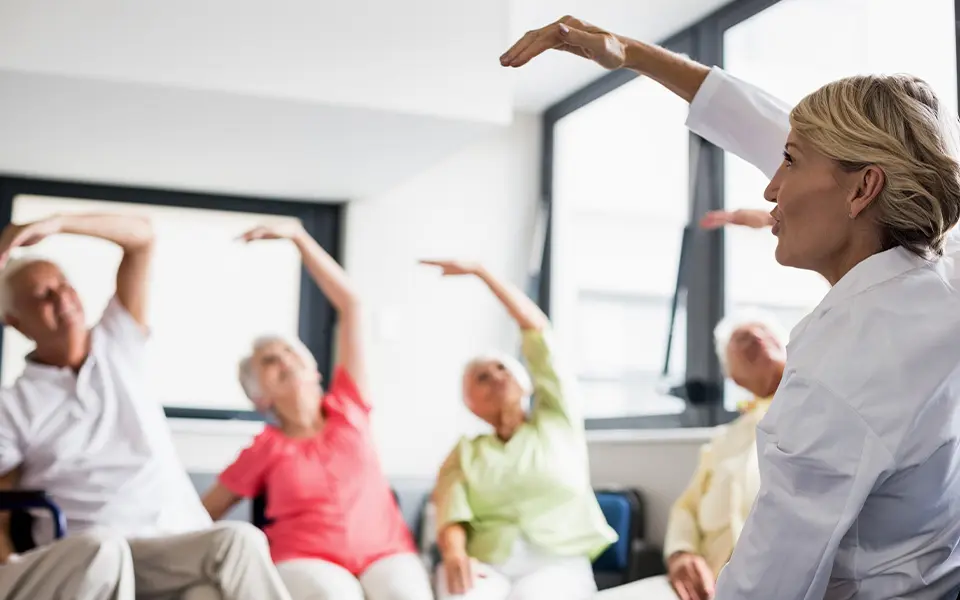 Seniors doing exercises at an adult day care facility