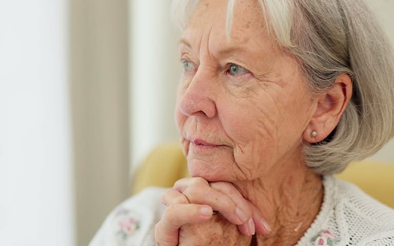 Thinking, anxiety and senior woman with fear, stress or Alzheimer, grief or trauma memory in her home.