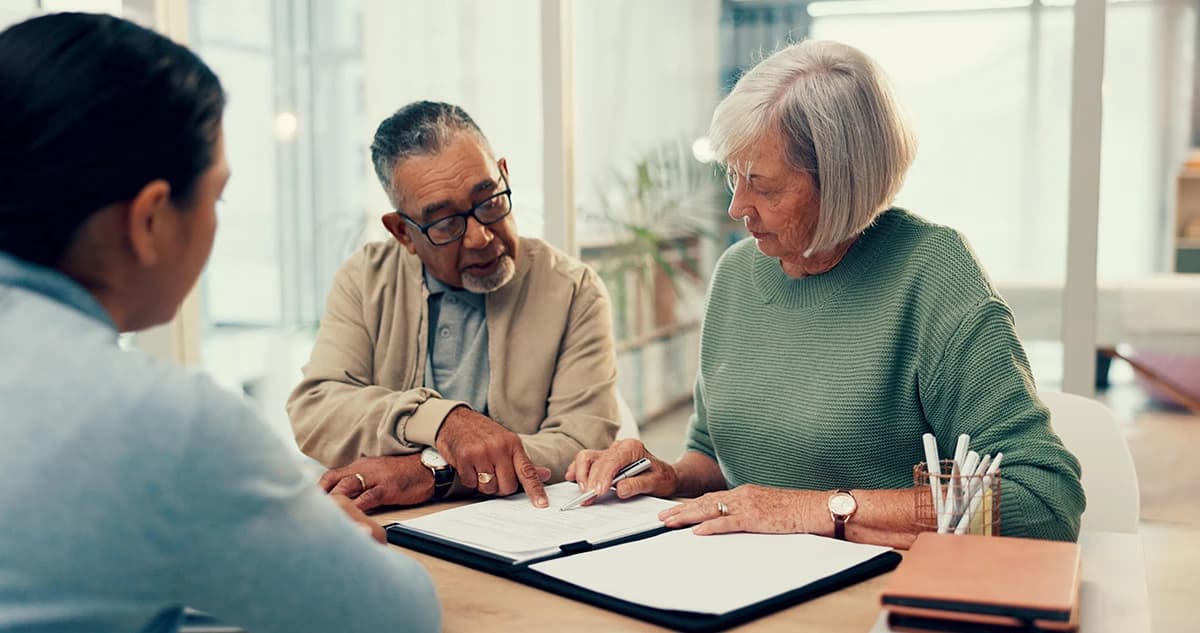 woman looking over living plan with consultants