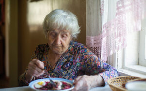 Senior woman with dementia having appetite loss